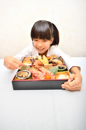 Girl enjoy japanese cuisineの写真素材