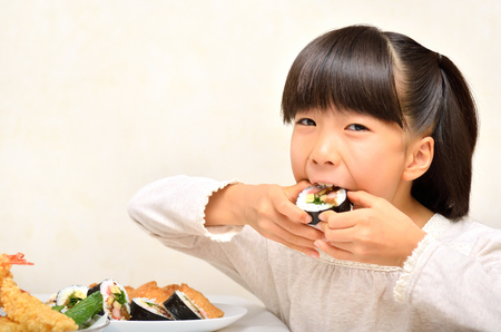 Girl enjoy japanese cuisineの写真素材