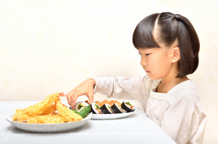 Girl enjoy japanese cuisineの写真素材