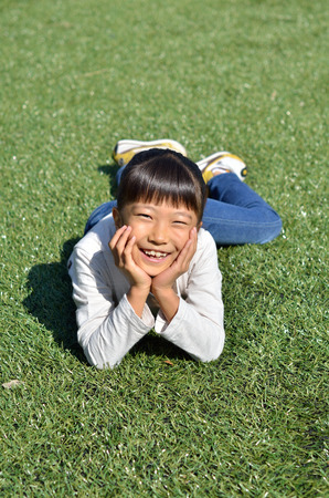 Girls rest her chin on her handsの写真素材