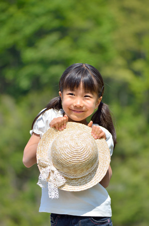 Smiling girls (straw hat)の写真素材