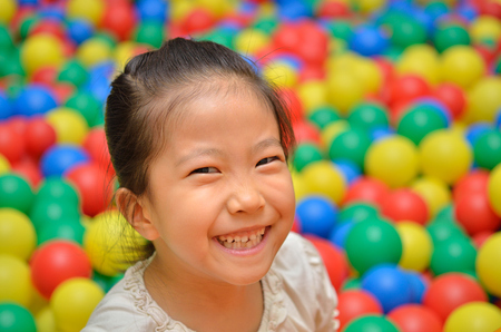 Girl playing with ballの写真素材