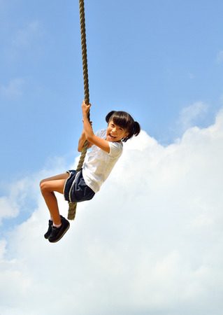 Girls playing in the blue skyの写真素材