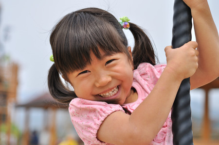 Girls playing in the blue skyの写真素材
