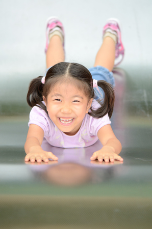 Girls playing in the parkの写真素材