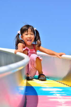 Girls playing in the parkの写真素材