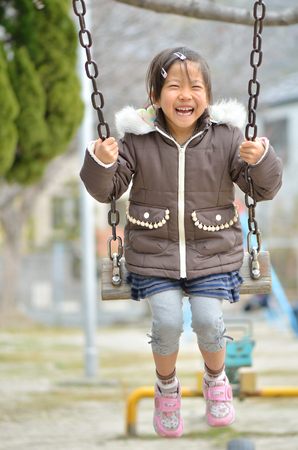Girls playing in the parkの写真素材