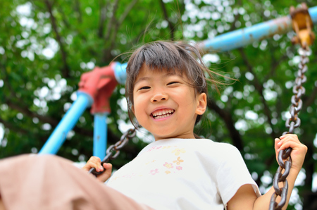 Girls playing in the parkの写真素材