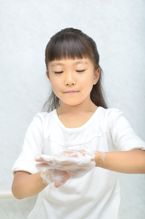 Girls washing her handsの写真素材