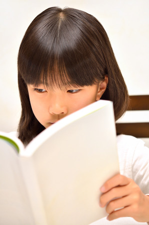 Girls reading bookの写真素材