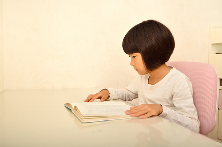 Girls reading bookの写真素材