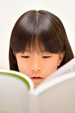 Girls reading bookの写真素材