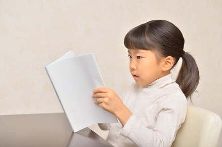 Girls reading bookの写真素材