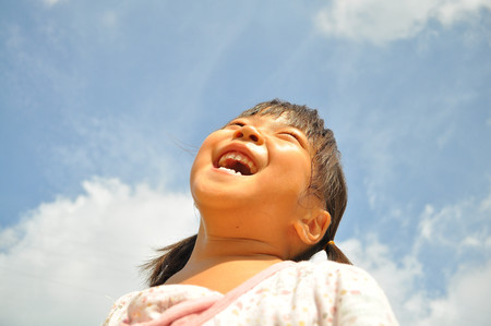 Girl's smiling in the blue sky