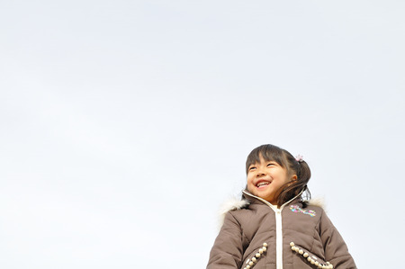 Girl's smiling in the skyの写真素材