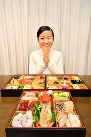 Japanese Girl Enjoys New Year's Party at Homeの写真素材