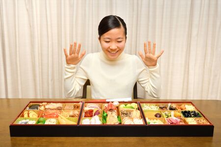 Japanese Girl Enjoys New Year's Party at Homeの写真素材