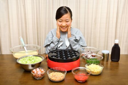 Japanese girl enjoys Octopus fritters partyの写真素材
