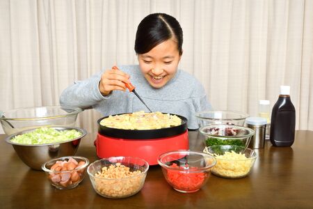 Japanese girl enjoys Octopus fritters partyの写真素材