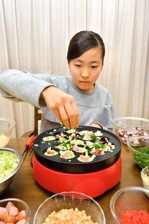 Japanese girl enjoys Octopus fritters partyの写真素材