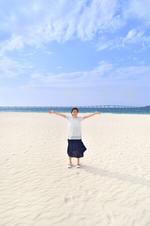 Japanese girl smiling in the beach - Okinawa Miyakojimaの写真素材