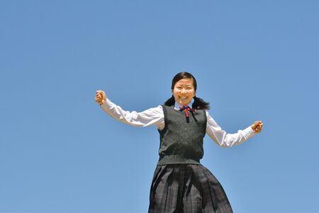 Japanese girl dancing in the blue skyの写真素材