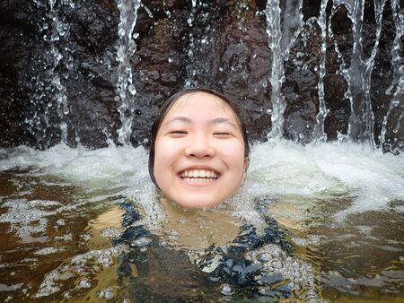 Japanese girl enjoy having the open air bathの写真素材