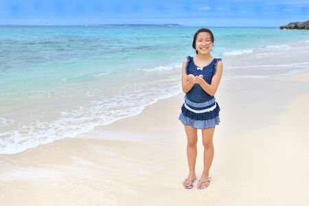 Japanese girl smiling in the beach Okinawa Miyakojimaの写真素材