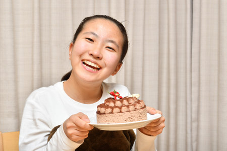 Japanese girl with the whole of cakeの写真素材