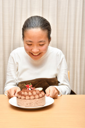 Japanese girl with the whole of cakeの写真素材