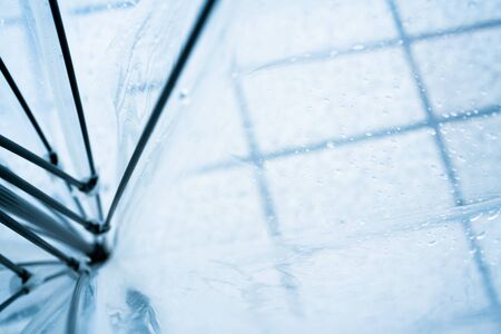 Transparent umbrella on a rainy day