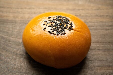Sweet red bean bun on wooden tableの写真素材