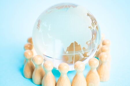 Image of people holding hands around the globe