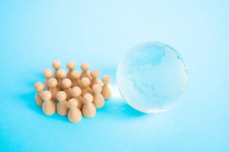 Globe and miniature dollの写真素材