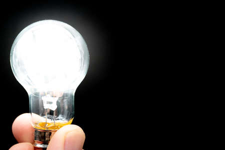 Glowing Light Bulb on Black Background,Inspire Ideas