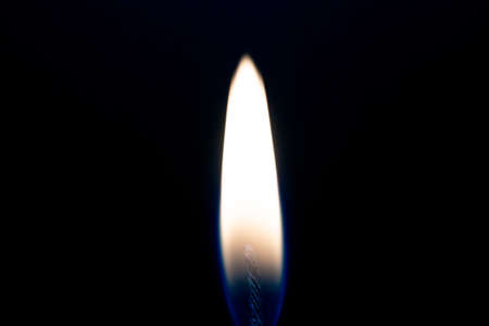 Candle flame on black background