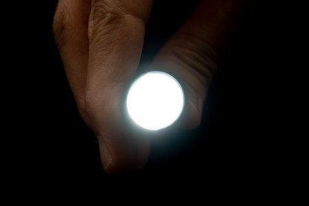 Penlight on black backgroundの写真素材