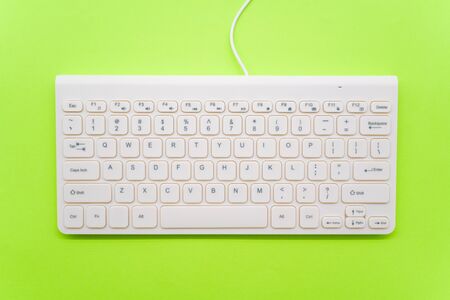 Keyboard on green backgroundの写真素材