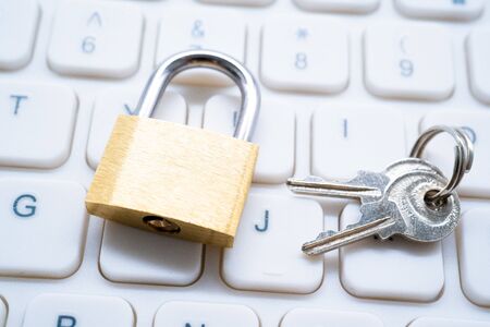 Golden Padlock on Keyboard Cyber Security Conceptの写真素材