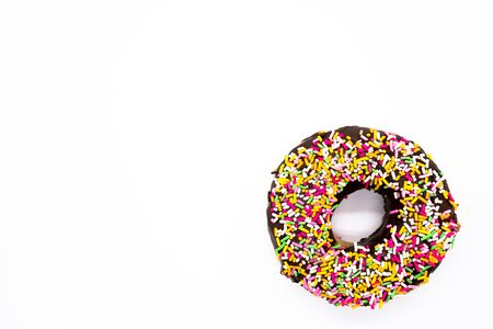 Color spray chocolate donut on white backgroundの写真素材