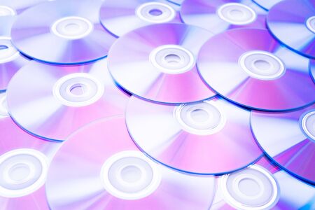 Lots of CD discs and DVDsの写真素材