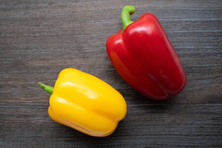 Red and yellow fresh paprika peppers
