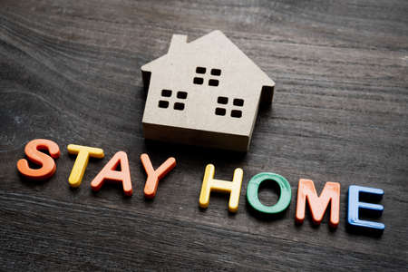 Stay Home letters and a model of the houseの写真素材