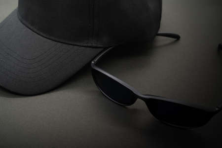 Image of a suspicious person.
Sunglasses and a black hat.の写真素材