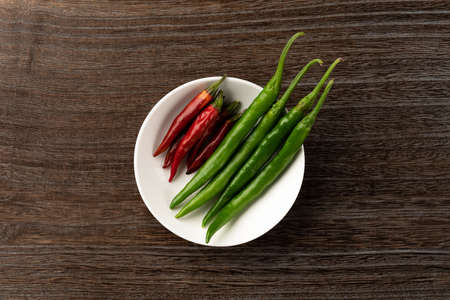 Green and red chile peppersの写真素材