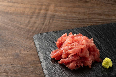 oily tuna, rich meat scraped from the skin and bones