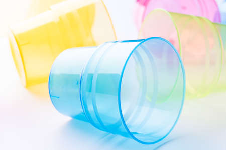 Multi-colored plastic cups on white backgroundの写真素材