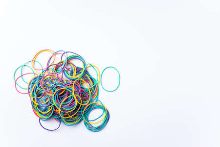 Colorful rubber bands on white background