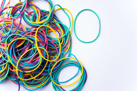 Colorful rubber bands on white background