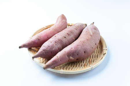 Sweet potatoes on a white backgroundの写真素材